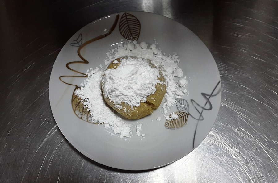 Cheese maamoul sprinkled with powdered sugar